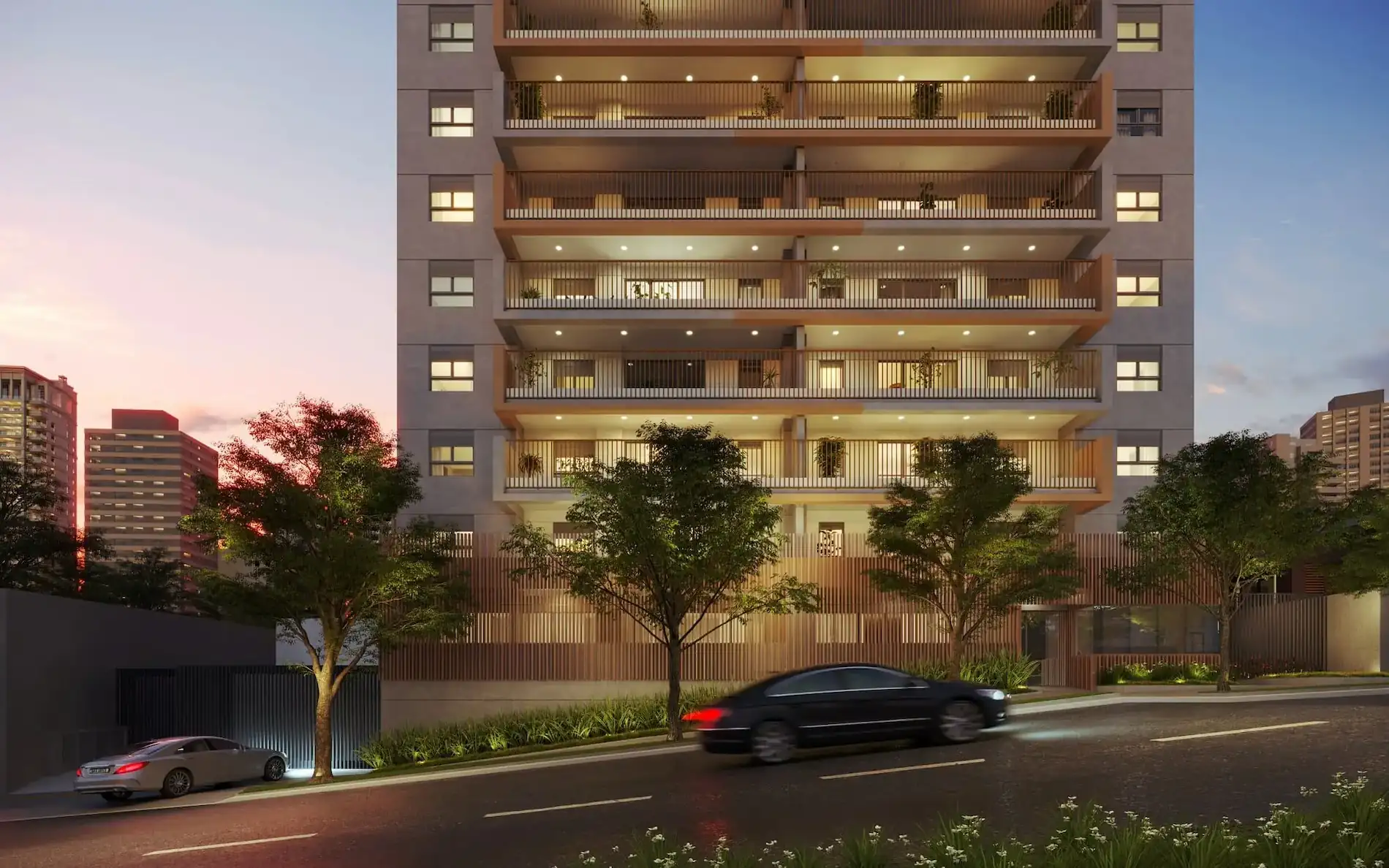 Fachada do Signatur, da Tarjab, com design contemporâneo, iluminação noturna e paisagismo na calçada.